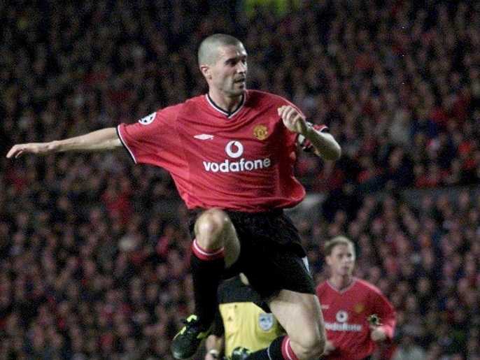 epa00738837 (FILES) A November 2000 file photo of then Manchester United skipper Roy Keane in action leaping over Dynamo Kiev's Andrei Nesmachnyi during a Champions League Game. Keane, who at the beginning of the year joined Glasgow Celtic, announced his retirement from football because of injury. He claimed he was quitting following medical advice. EPA/GERRY PENNY